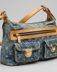 Louis Vuitton Monogram Denim Baggy PM shoulder bag in blue washed denim with tan leather trim and gold hardware.