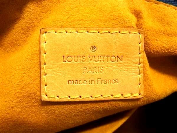Louis Vuitton Paris made in France heat stamp on tan leather interior of a Monogram Denim Baggy PM.