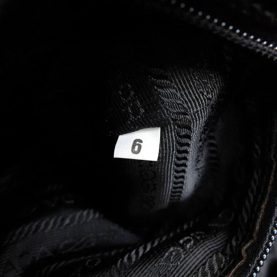 prada_triangle_logo_backpack96499853232998 - zeitlos.